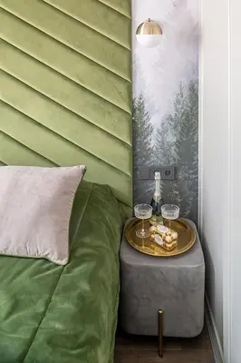 a bed with a table with wine glasses on it at Kaunas old town apartment in Kaunas