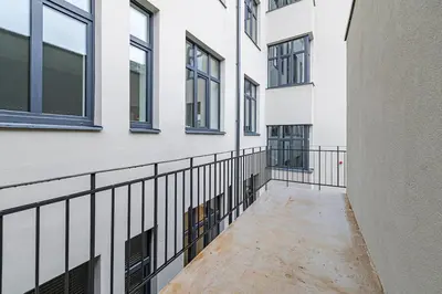 an empty hallway of a building with windows at Vytauto 43 Residence 3 by Domvia in Kaunas