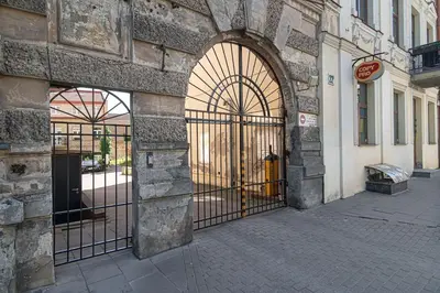 an entrance to a building with an iron gate at 1 bedroom apartment in old town with free parking in Vilnius