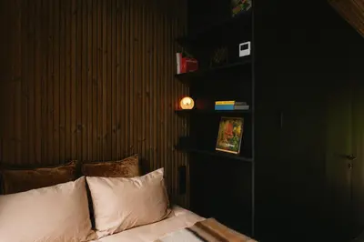 a bedroom with a bed with two pillows at Blackview cabin in Kulautuva
