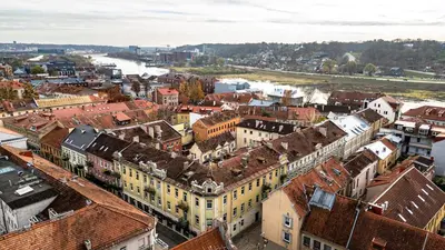 an aerial view of a city with buildings and a river at Charming Apartment in Kaunas Old Town in Kaunas