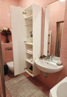 a bathroom with a sink and a toilet and a mirror at Cozy Fryko Era Home - 1929, 2 double beds in Kaunas