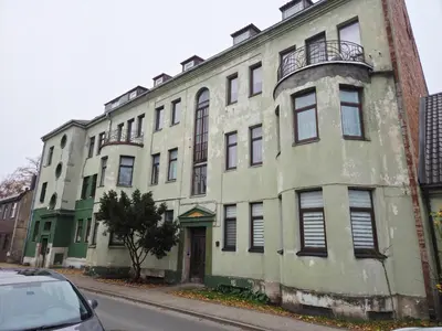 an old building on the side of a street at Cozy Fryko Era Home - 1929, 2 double beds in Kaunas