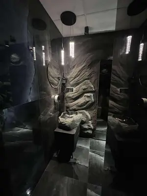 a bathroom with a toilet and a mirror at Host 5 apartment in Kaunas