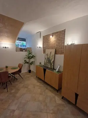 an office with a table and a dining room at Flowers appartments in Vilnius