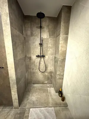 a bathroom with a shower with a shower at EGo Apartment in Vilnius