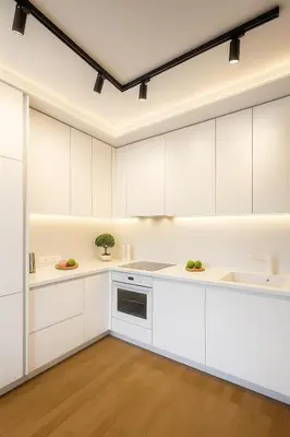 a kitchen with white cabinets and a sink at Self Check-in Home in Vilnius center in Vilnius