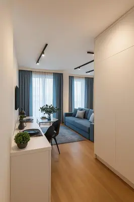 a living room with a couch and a table at Self Check-in Home in Vilnius center in Vilnius