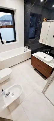a bathroom with a sink and a toilet and a tub at White house in Vilnius in Vilnius