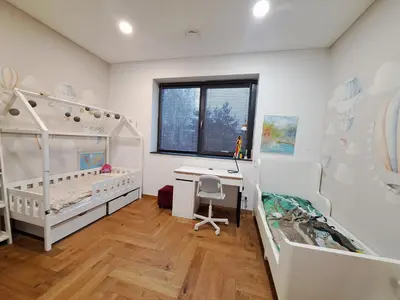 a room with two beds and a desk in it at White house in Vilnius in Vilnius