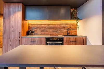 a kitchen with a sink and a counter top at SoHo Gallery Loft 437 in Kaunas