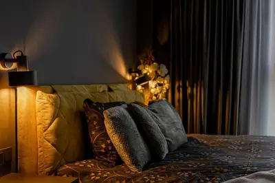 a bedroom with a bed with pillows on it at Vincent City Luxe - Near Clinic, Arena and Stadium in Kaunas