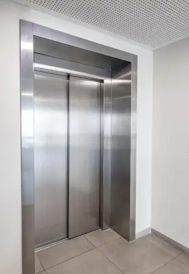 a stainless steel elevator in a building at Vincent City Luxe - Near Clinic, Arena and Stadium in Kaunas