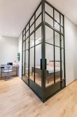 a large glass room with a bed in it at Nordic Apartment in Kaunas Old Town Area and Balcony in Kaunas