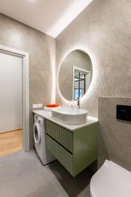 a bathroom with a sink and a washing machine at Nordic Apartment in Kaunas Old Town Area and Balcony in Kaunas