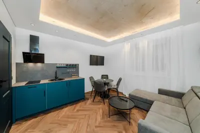 a living room with a couch and a table at Chamber House in Kaunas