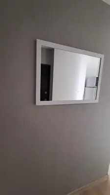 a mirror on a wall in a room at Irenos Nuoma in Šiauliai