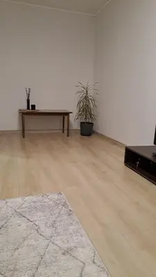 a room with a wooden table and a table at Irenos Nuoma in Šiauliai