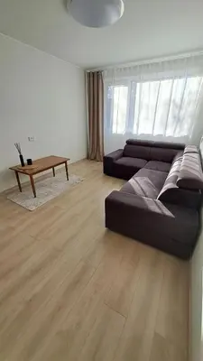 a living room with a couch and a coffee table at Irenos Nuoma in Šiauliai