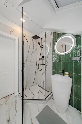 a bathroom with a shower and a white tub at Chamber Luxury House in Kaunas
