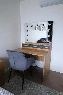 a desk with a chair in a room at Apartamentai Šiaulių miesto centre in Šiauliai