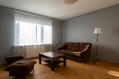 a living room with a couch and a table at Julias's House in Šiauliai