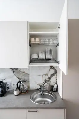 a kitchen with a sink and a counter top at Cozy Apartment for Rest & Creativity 6 in Vilnius