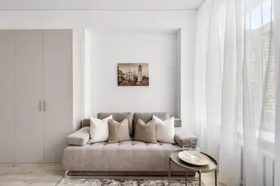 a living room with a couch and a table at Cozy Apartment for Rest & Creativity 6 in Vilnius