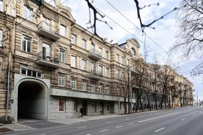 a large building on the side of a street at Šopeno Butas Cozy Quiet and Well-Located 5 in Vilnius