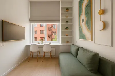 a living room with a couch and a window at 8 Loft in Vilnius
