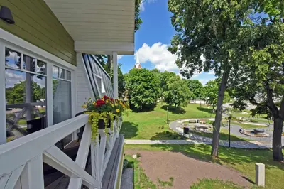 a porch of a house with a wreath of flowers at Vila Klasika in Birštonas