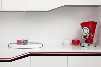 a kitchen counter with a red blender on it at Modern White Moss Apartment Kaunas Center in Kaunas