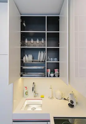 a kitchen with a sink and a counter top at Modern White Moss Apartment Kaunas Center in Kaunas