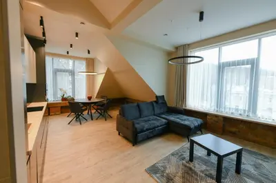a living room with a couch and a table at Valdau NT in Kaunas