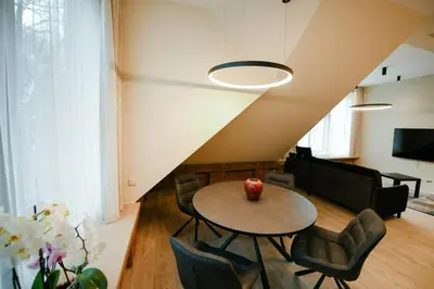 a living room with a table and chairs at Valdau NT in Kaunas