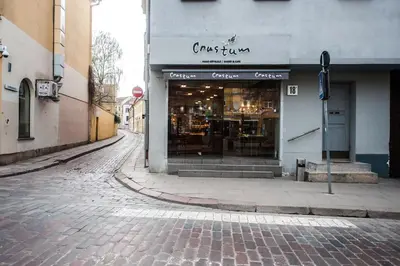 an empty street with a store on the side of a building at V 18 - Superior & Great views to Vokieciu street in Vilnius