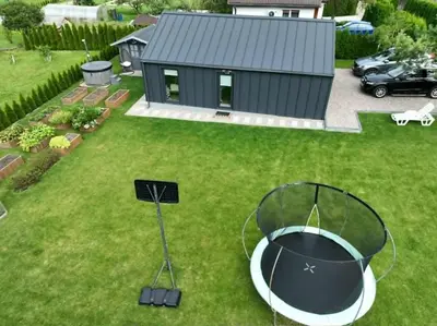 an aerial view of a backyard with a fire pit at Cozy House By VP in Anykščiai