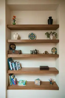 a room with wooden shelves with books at St Michael's terrace in Vilnius