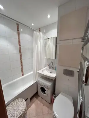 a bathroom with a sink and a toilet and a bath tub at Lina in Vilnius