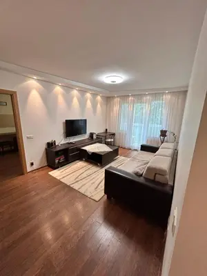 a living room with a couch and a television at Lina in Vilnius