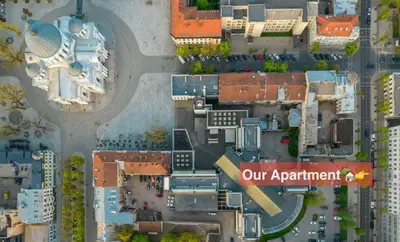 an aerial view of a city with a sign that reads our apartment at Central Apartment in Kaunas with Free Parking in Kaunas