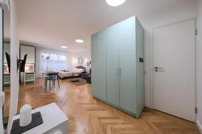 a living room with a large sliding glass door at Central Apartment in Kaunas with Free Parking in Kaunas