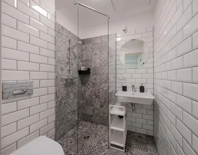 a white bathroom with a shower and a sink at Central Apartment in Kaunas with Free Parking in Kaunas