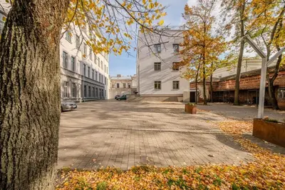 an empty street in a city with buildings at Central Apartment in Kaunas with Free Parking in Kaunas