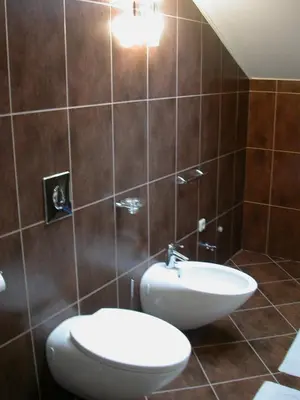 a bathroom with a toilet and a sink at Apartamentai Vilnius Užupis in Vilnius