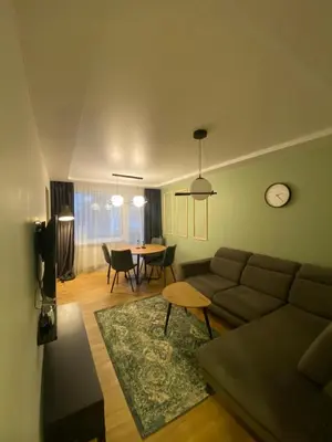 a living room with a couch and a table at Two Bedroom COZY apatment in Vilnius