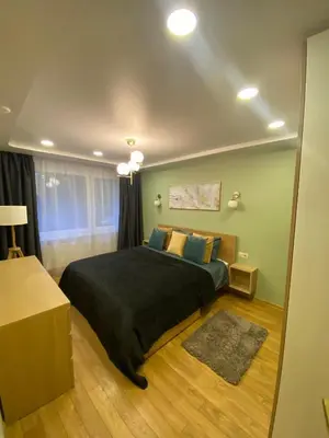 a bedroom with a large bed in a room at Two Bedroom COZY apatment in Vilnius