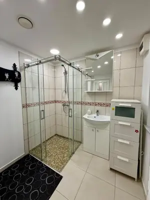 a bathroom with a shower and a sink at Guest house 10 minutes from the city center in VNO