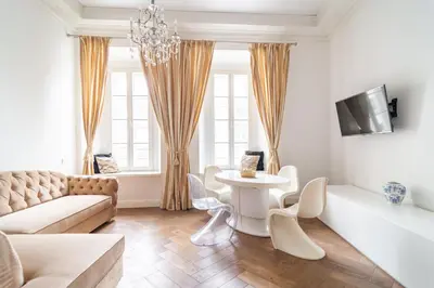 a living room with a couch and a table at Old Town Luxury apartment self check inn in Vilnius