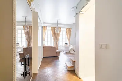 a living room with a couch and a table at Old Town Luxury apartment self check inn in Vilnius